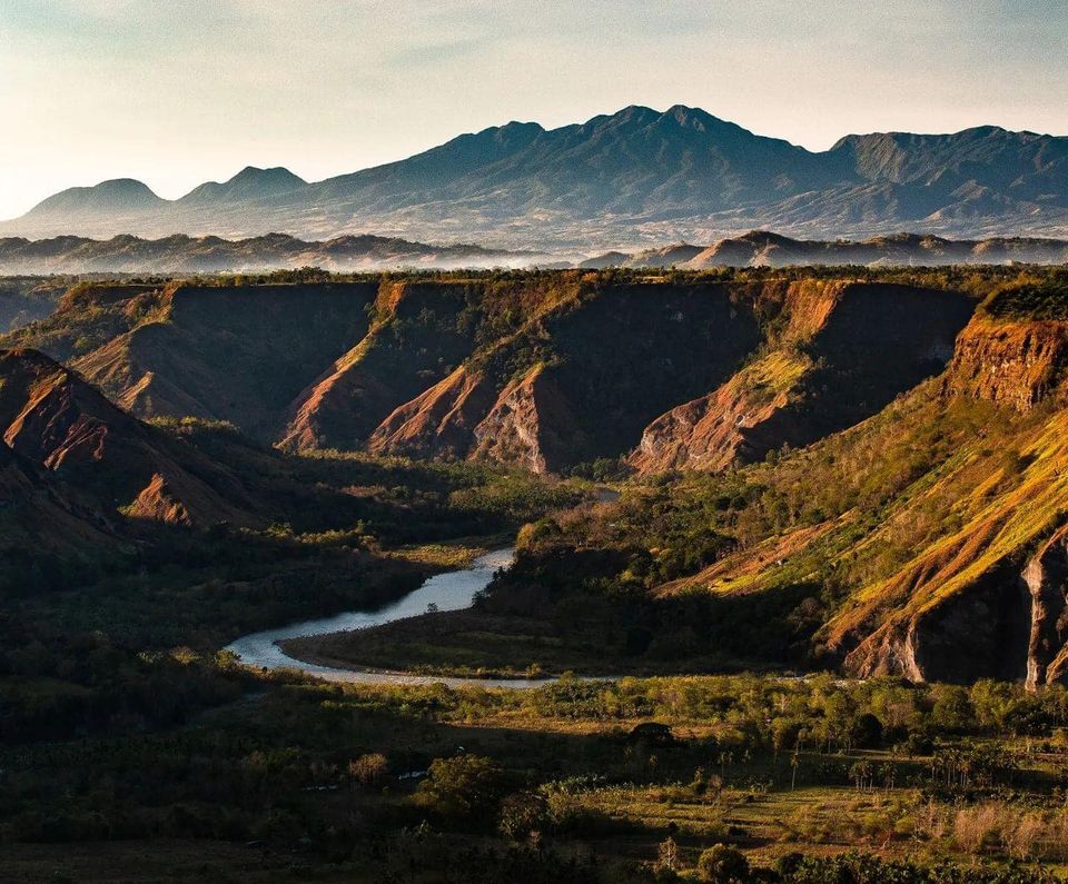 The Bukidnon highlands — green plateau stretching toward the Kitanglad Range